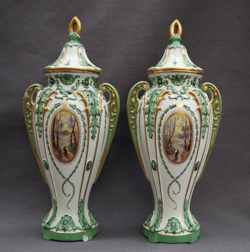 A pair of Royal Bonn pottery twin handled vases,