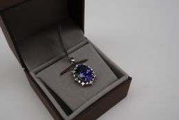 Gemporia - A 5.74cts oval Tanzanite and diamond platinum set Lorique pendant, metal 3.