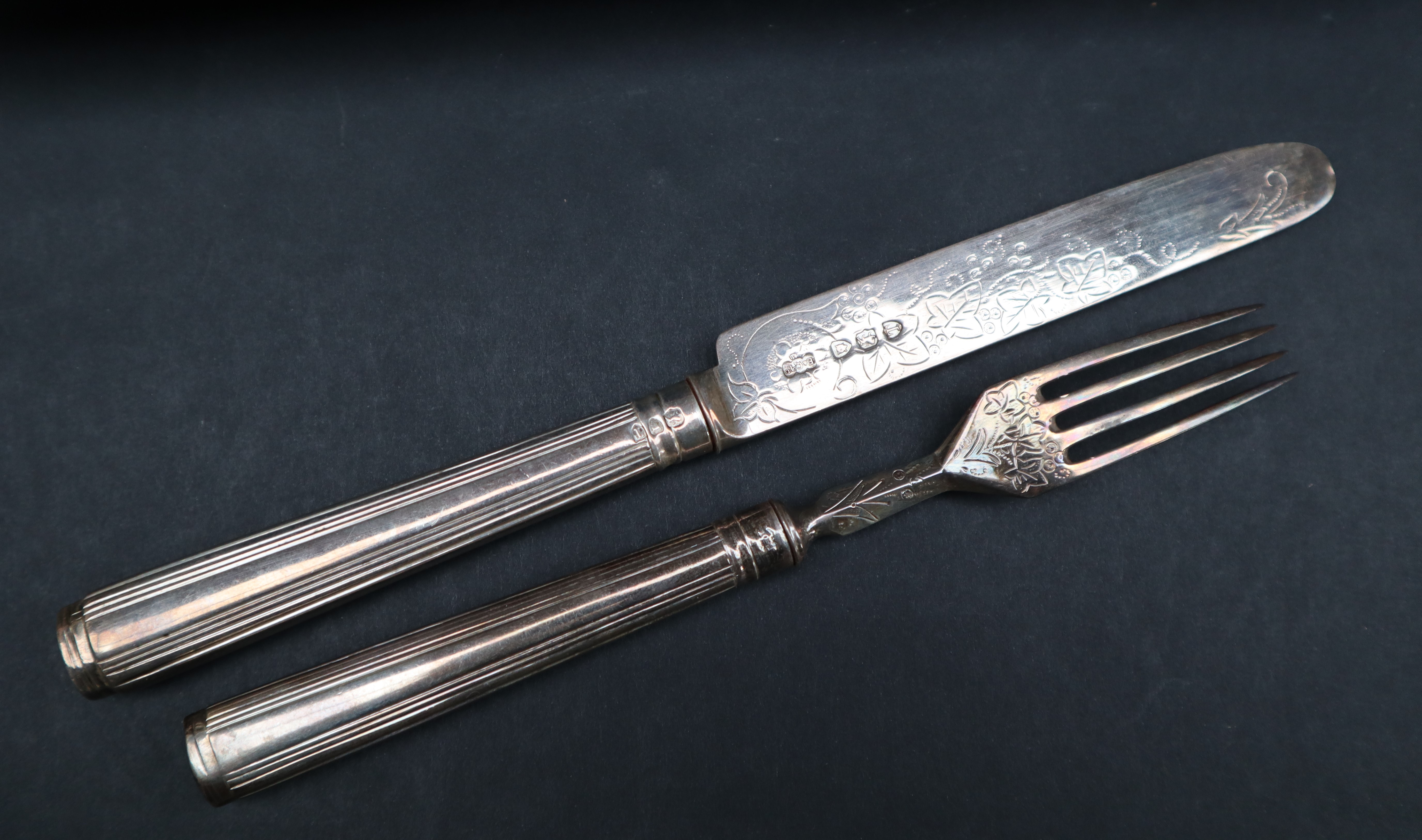 A late Victorian silver fruit set, with line decorated handles and leaf decorated blades and tines, - Image 2 of 3