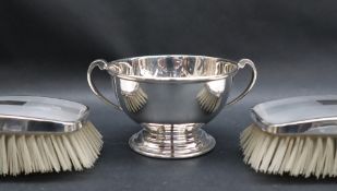 A George VI silver twin handled bowl of circular form on a stepped foot, Sheffield, 1943,