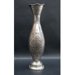 A Persian white metal repousse flared vase, with rope twist rim,