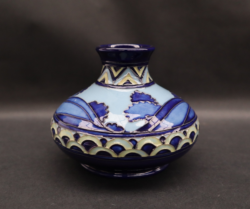 A Moorcroft pottery Second Dawn squat vase with a blue ground, impressed mark, dated 2012,