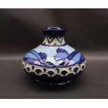 A Moorcroft pottery Second Dawn squat vase with a blue ground, impressed mark, dated 2012,