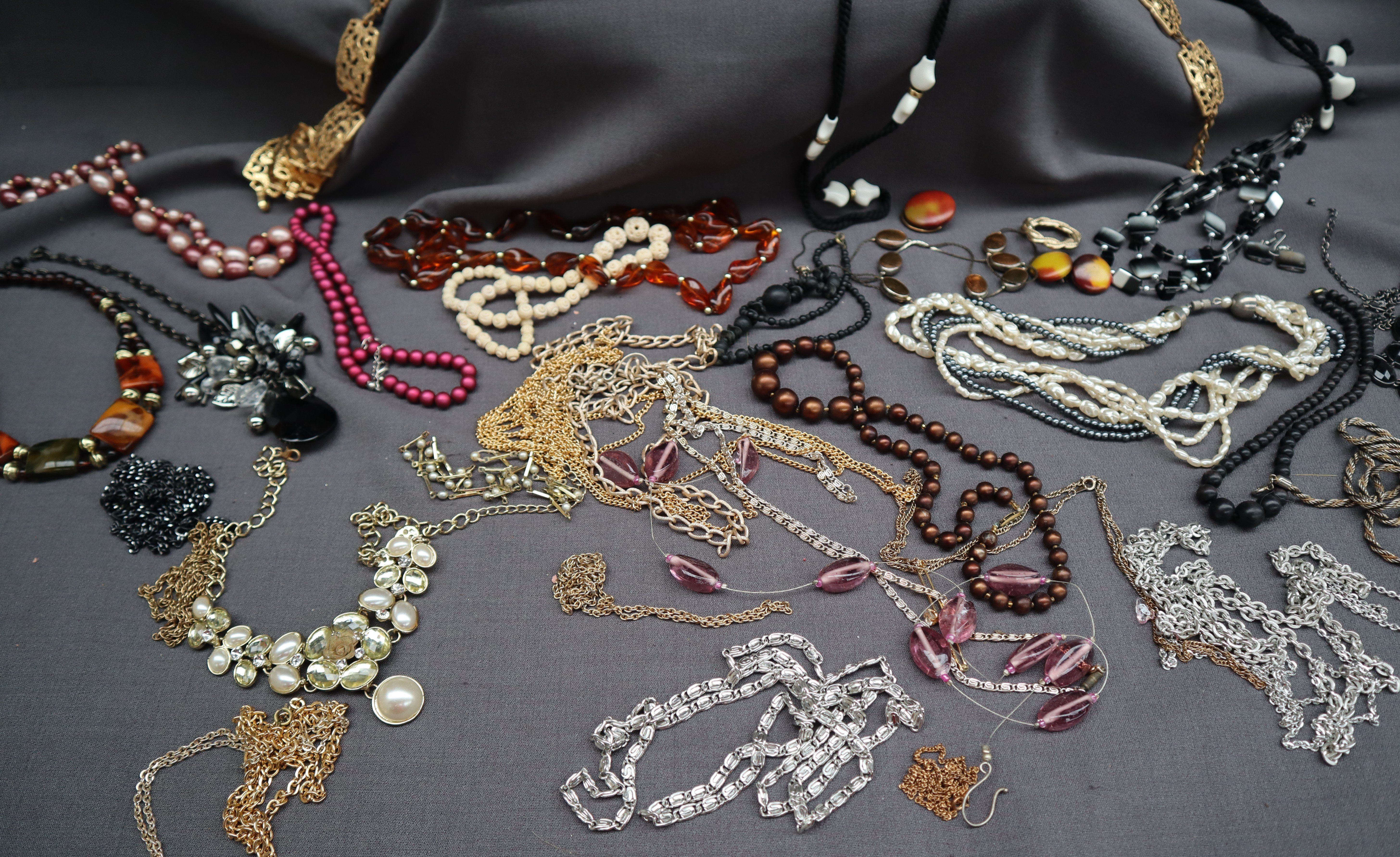 A collection of costume jewellery including beaded necklaces, brooches, - Image 2 of 3