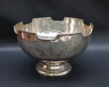 A George V silver bowl with a castellated top on a spreading foot, London, 1919, 21cm diameter,