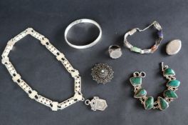 An Italian silver hinged bangle together with other bracelets,