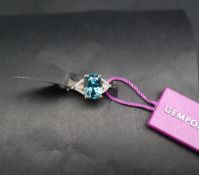 Gemporia - A Ratanakiri blue Zircon and Diamond 18k gold Lorique ring, set with a 7.