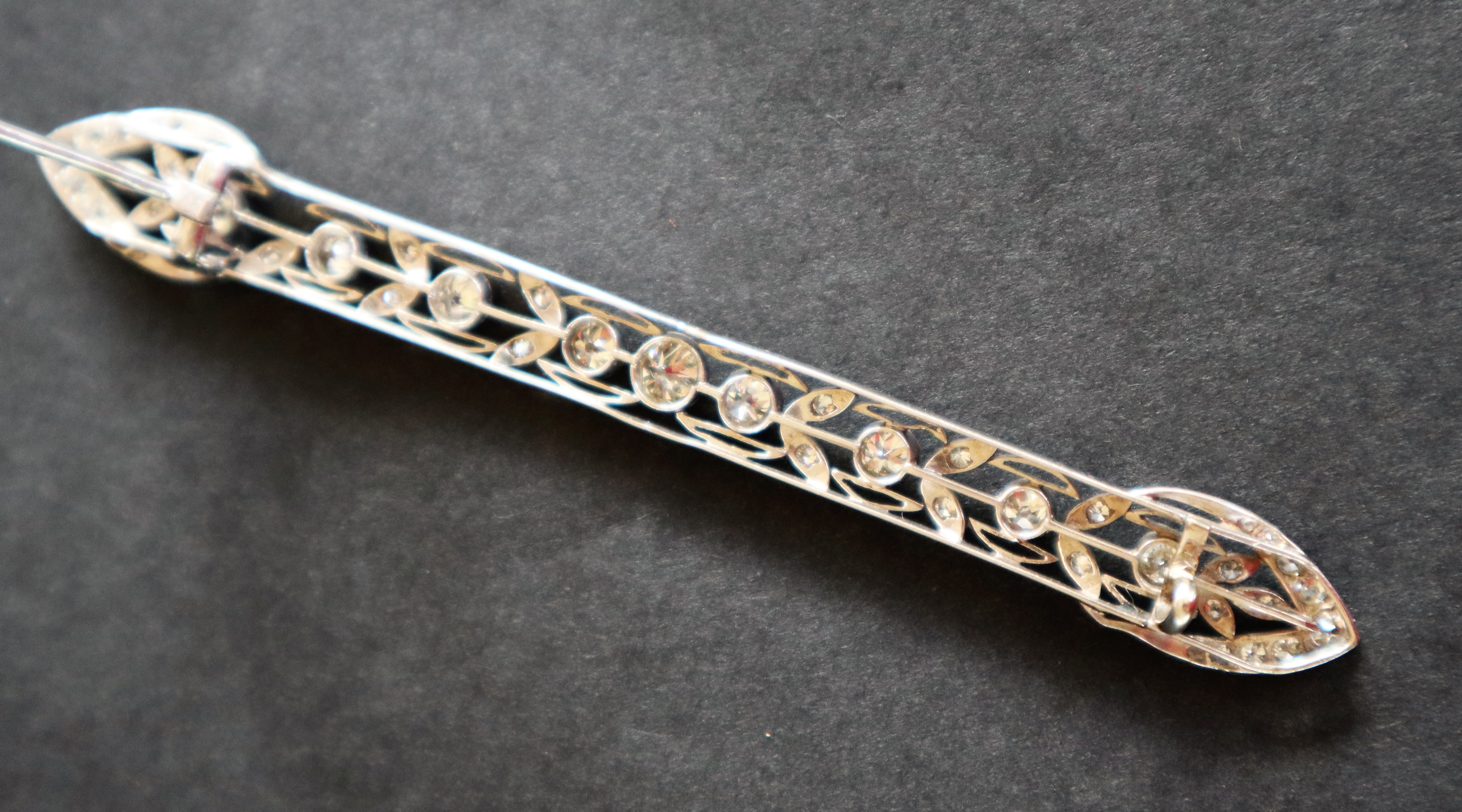 A Victorian diamond bar brooch, set with round old cut diamonds to a white metal wirework setting, - Image 6 of 6