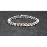 A 14ct white gold tennis bracelet set with thirty round brilliant cut diamonds each approximately 0.