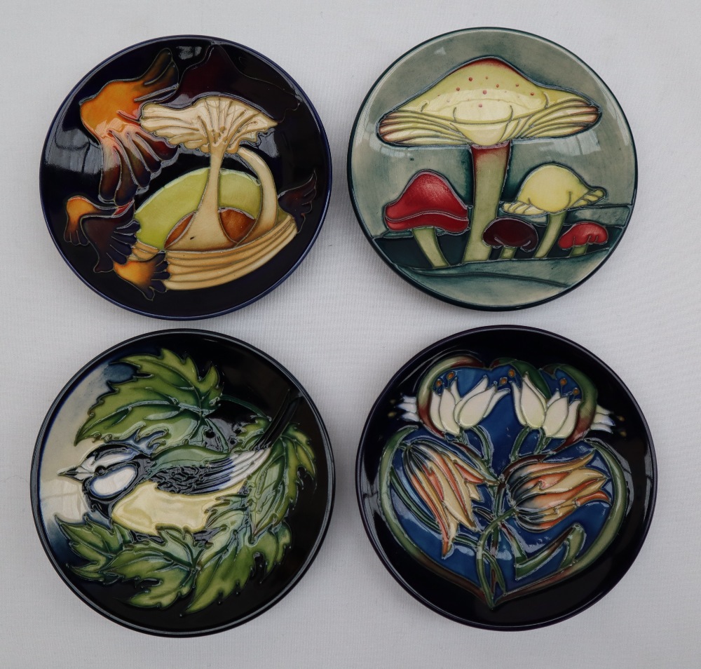 A Moorcroft pottery pin tray of circular form decorated in the Parasol Dance pattern,