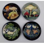 A Moorcroft pottery pin tray of circular form decorated in the Parasol Dance pattern,