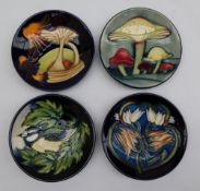 A Moorcroft pottery pin tray of circular form decorated in the Parasol Dance pattern,
