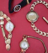 A lady's Timor 9ct gold wristwatch with a circular dial and Arabic numerals on a 9ct gold strap,