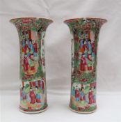 A pair of Cantonese porcelain vases with a flared rim and cylindrical body,