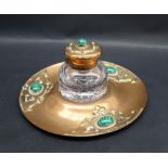 An Arts and Crafts desk inkwell of circular form set with malacite beads and raised decoration, 20.