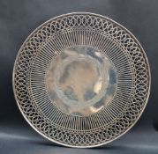 A Sterling white metal pedestal dish, with a pierced and scrolling border, 22.