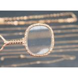 A 9ct gold magnifying glass approximately 13 grams together with assorted 9ct gold chains,