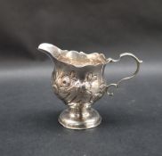 An early George III silver jug of baluster form,