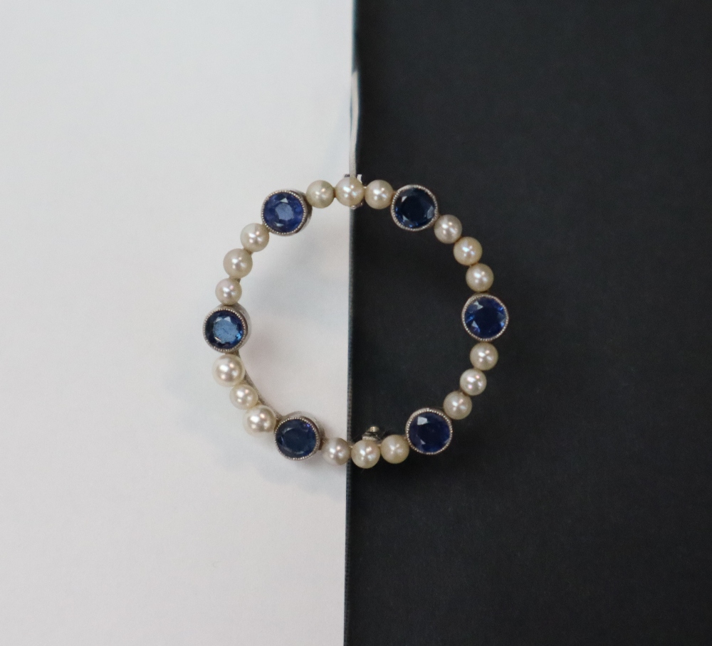 A sapphire and pearl brooch, of circular form set in white metal marked 9ct, approximately 3. - Image 4 of 6