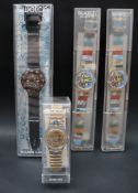 A Swatch Scuba 200 wristwatch together with two One Hundred Million Swatch wristwatches and another