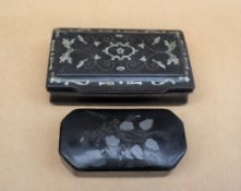 A papier mache snuff box of rectangular form inlaid with white metal birds, flowers and leaves,