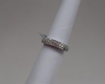 Gemporia - A diamond set platinum Tomas Rae ring, set with forty three round cut diamonds, metal 5.