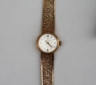 A lady's 9ct yellow gold Omega wristwatch,