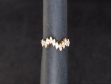 A diamond set wave ring,