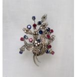 An 18ct gold diamond, ruby, and sapphire brooch of floral style, signed Chiappe,