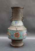 A Japanese bronze and champleve enamel ring handled vase with geometric decoration,