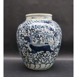 A Chinese blue and white crackle glaze vase profusely decorated with dogs of foo amongst scrolling