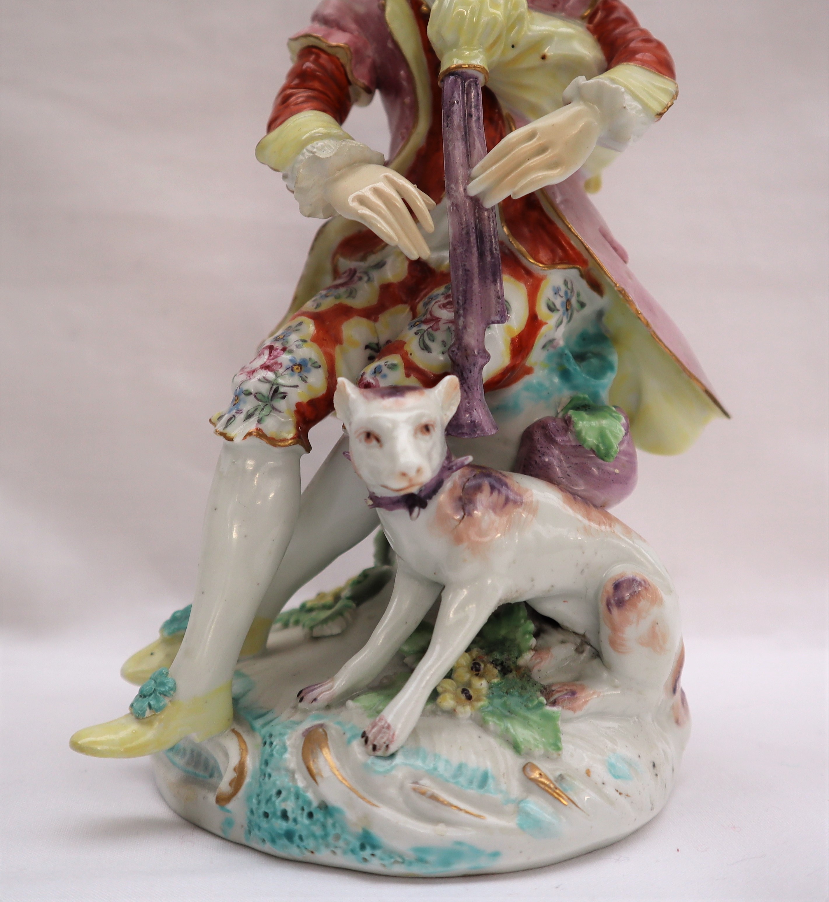 A Derby porcelain figure seated playing bagpipes with a dog at his feet on a circular base, 19. - Image 7 of 8