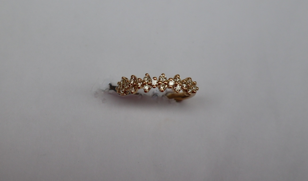 Gemporia - An 18k gold natural yellow diamond Tomas Rae ring, set with nineteen round diamonds,