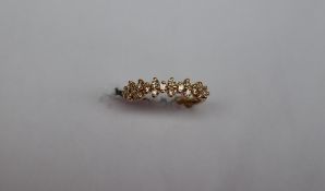 Gemporia - An 18k gold natural yellow diamond Tomas Rae ring, set with nineteen round diamonds,