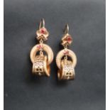 A pair of 14ct yellow gold drop earrings set with rubies,