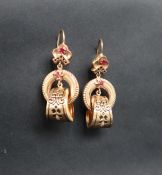 A pair of 14ct yellow gold drop earrings set with rubies,