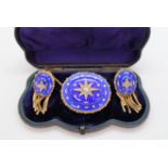 A Victorian yellow metal, diamond, and blue enamel brooch of oval form,