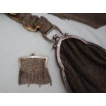 A small silver chain mail purse together with two other white metal purses