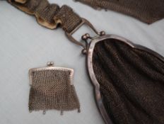 A small silver chain mail purse together with two other white metal purses