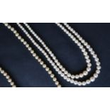 A double strand pearl necklace with graduated pearls, to a marcasite set clasp,