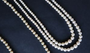 A double strand pearl necklace with graduated pearls, to a marcasite set clasp,