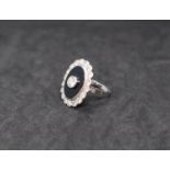 A diamond and onyx dress ring,