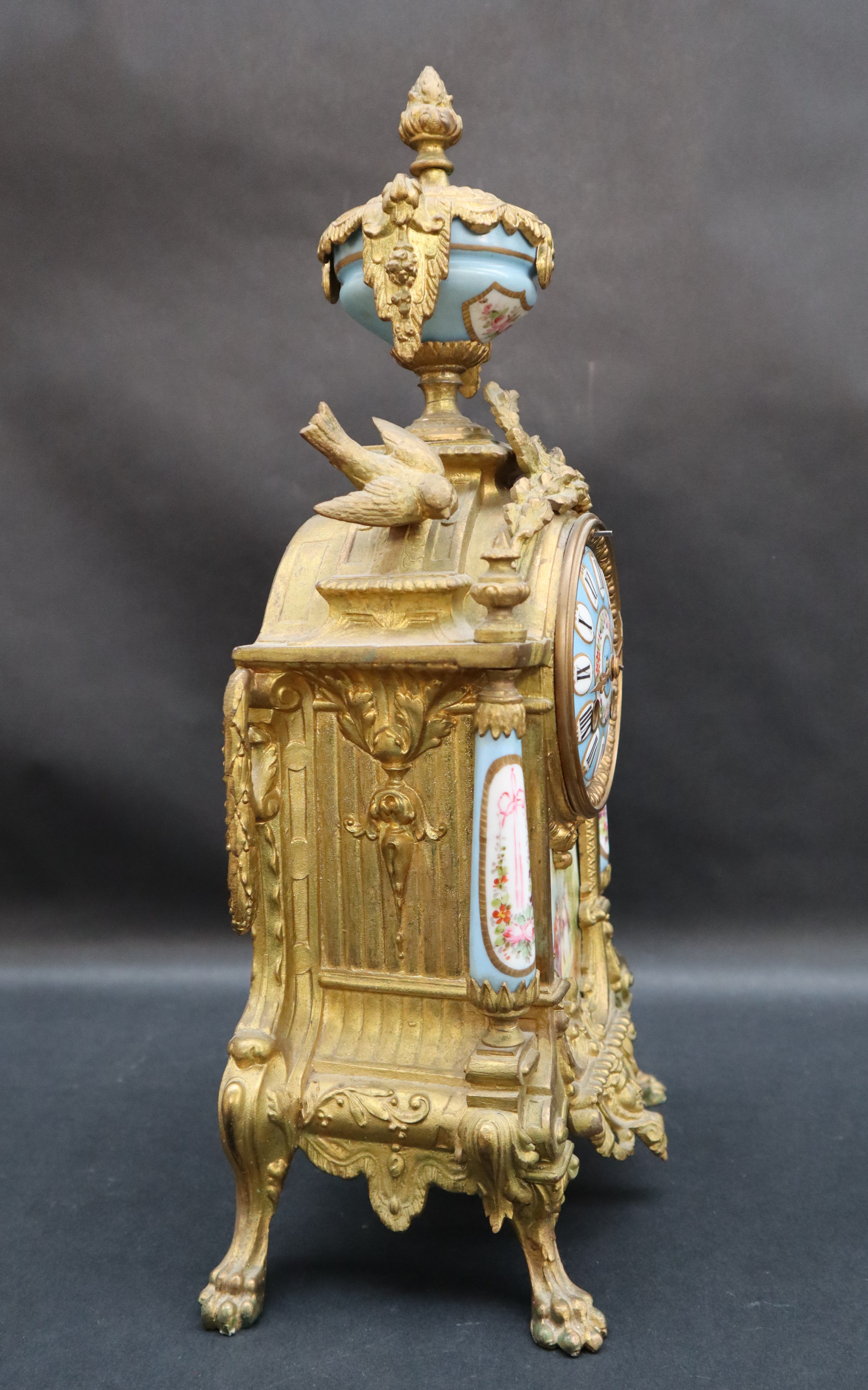 A 19th century French ormolu clock with a porcelain urn surmount, - Image 5 of 5