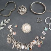 A Victorian crown, dated 1890 together with a white metal charm bracelet,