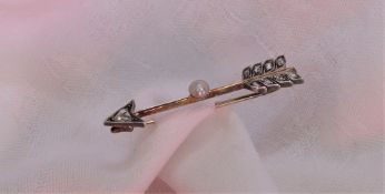 A diamond pearl set bar brooch of arrow form, with a central pearl and rose cut diamonds, 50mm long,