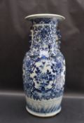 A large Chinese blue and white porcelain vase, with a shaped flared rim above a floral,