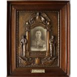 A World War I bronzed plaster plaque "The Path of Duty Was The Way To Glory" in oak frame,