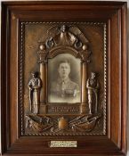 A World War I bronzed plaster plaque "The Path of Duty Was The Way To Glory" in oak frame,