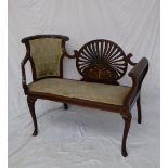 An Edwardian mahogany two seater settee, the central oval pierced panel with marquetry decoration,