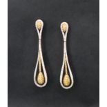 A pair of 18ct gold diamond drop earrings, set with white and yellow round brilliant cut diamonds,